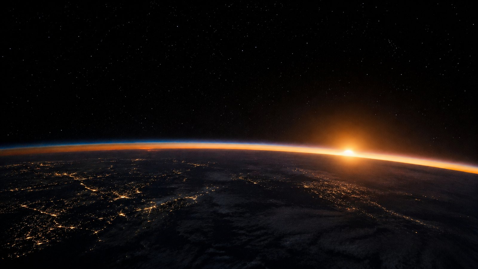 Earth from space at sunrise — the scale of what leaders shape